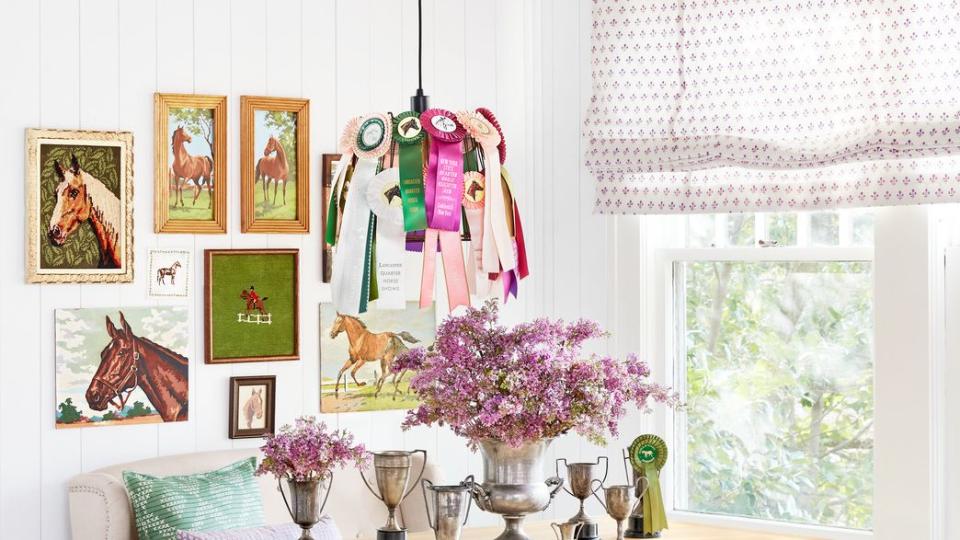 interior with equestrian collectibles on the wall and table and chandelier