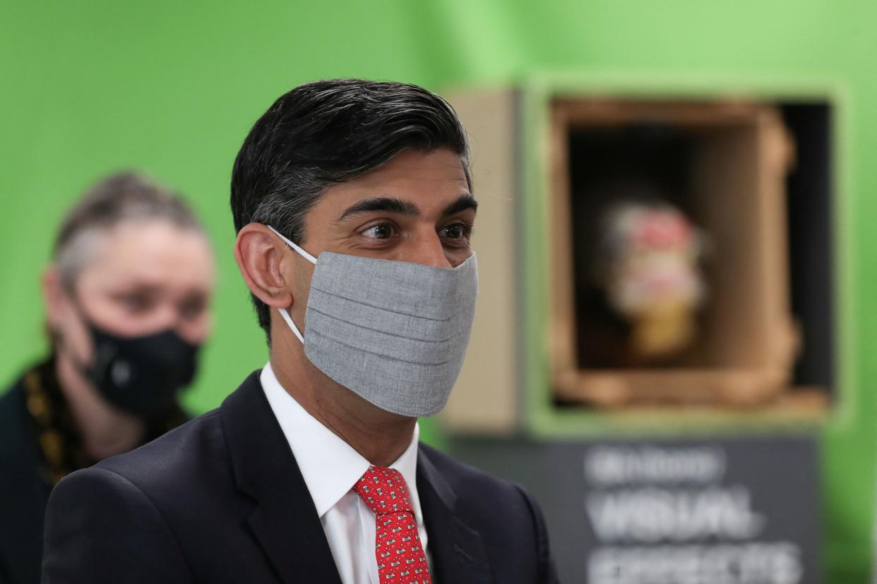 Britain's Chancellor of the Exchequer Rishi Sunak (R), reacts during a local by-election campaign visit to the Northern School of Art in Hartlepool, north east England on, April 30, 2021. (Photo by LEE SMITH / POOL / AFP) (Photo by LEE SMITH/POOL/AFP via Getty Images)