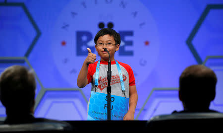 Ramon Padua from Guam gives a thumbs up as he competes in a preliminary round at the 89th annual Scripps National Spelling Bee at National Harbor in Maryland, U.S., May 25, 2016. REUTERS/Kevin Lamarque TPX IMAGES OF THE DAY