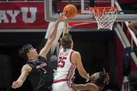 Utah guard Rollie Worster (25) goes to the basket as Jacksonville State center Maros Zeliznak (3) defends during the first half of an NCAA college basketball game Thursday, Dec. 8, 2022, in Salt Lake City. (AP Photo/Rick Bowmer)