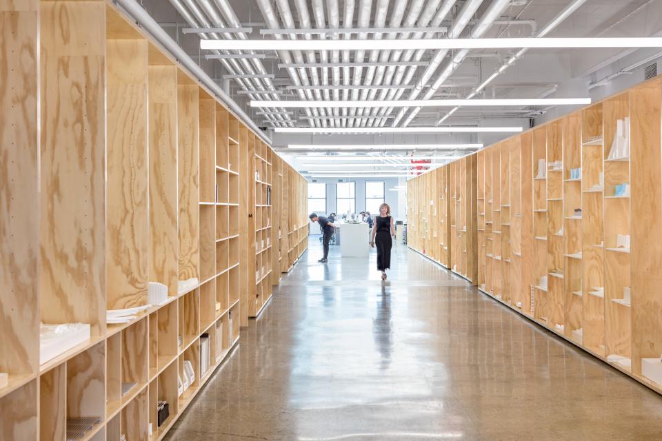 The exhibition hallway features deep plywood shelving built to house BIG’s extensive library of process models. “Before, we had to store many of these models in a facility in New Jersey,” says Bergmann. “But our designers use them for reference, and clients often ask to see them too.”