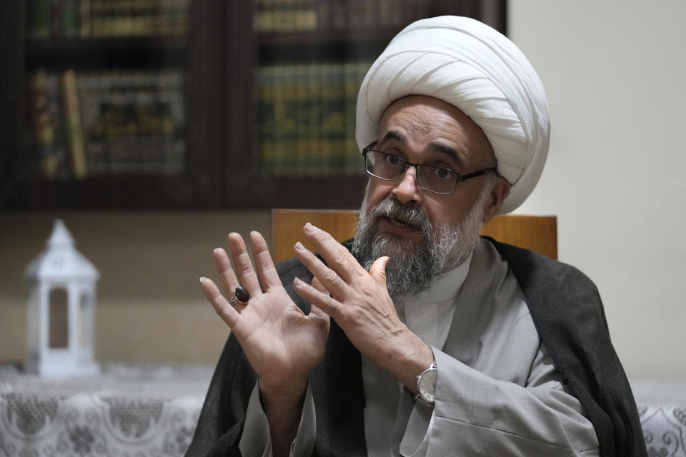 Shiite cleric Yasser Auda, gestures as he speaks during an interview with The Associated Press at his house in the southern suburb of Beirut, Lebanon, Friday, Aug. 18, 2023. Auda, who has angered politicians and religious leaders in Lebanon and Iraq by his harsh criticism says groups including Lebanon's Hezbollah are trying to silence voices of dissent within the sect including his days after he almost stripped of his religious status. (AP Photo/Hussein Malla)