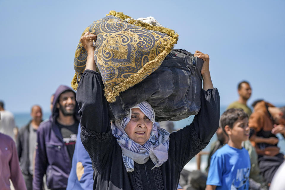 Displaced Palestinians trying to walk back from central Gaza Strip to northern Gaza Strip , Sunday, April 14, 2024. (AP Photo/Abdel Kareem Hana)