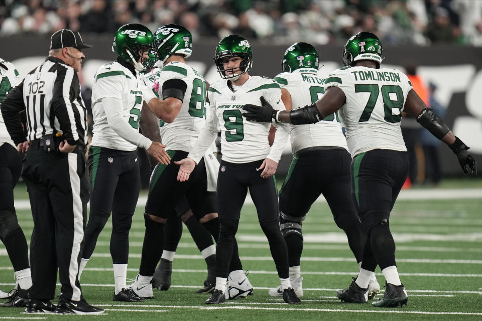 New York Jets place kicker Greg Zuerlein (9) is congratulated by teammates after kicking a field goal against the Los Angeles Chargers during the second quarter of an NFL football game, Monday, Nov. 6, 2023, in East Rutherford, N.J. (AP Photo/Seth Wenig)