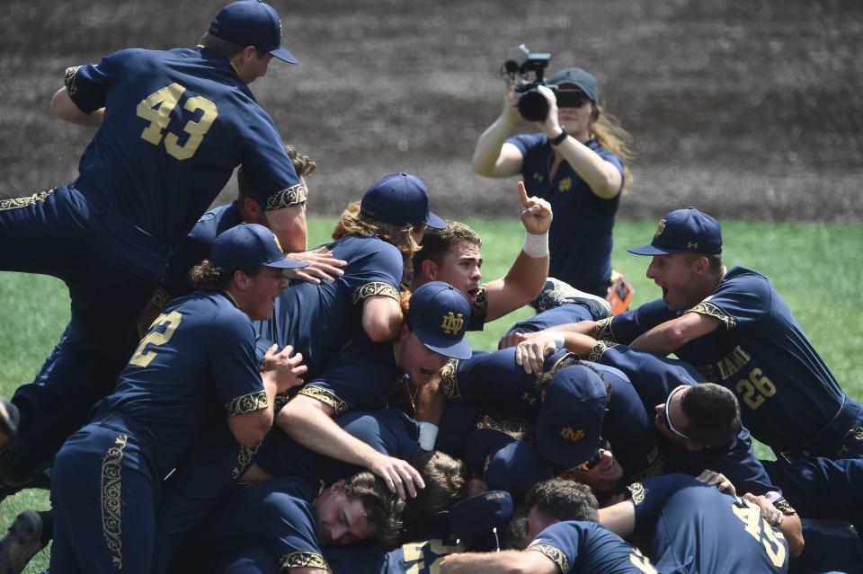Notre Dame's TJ Williams holds up the No. 1 as the team celebrates their win over Tennessee and a berth in the NCAA baseball College World Series. This is ND's third trip to the CWS and first since 2002. The 1957 team included Jim Morris, a former teacher who now resides in Springfield.