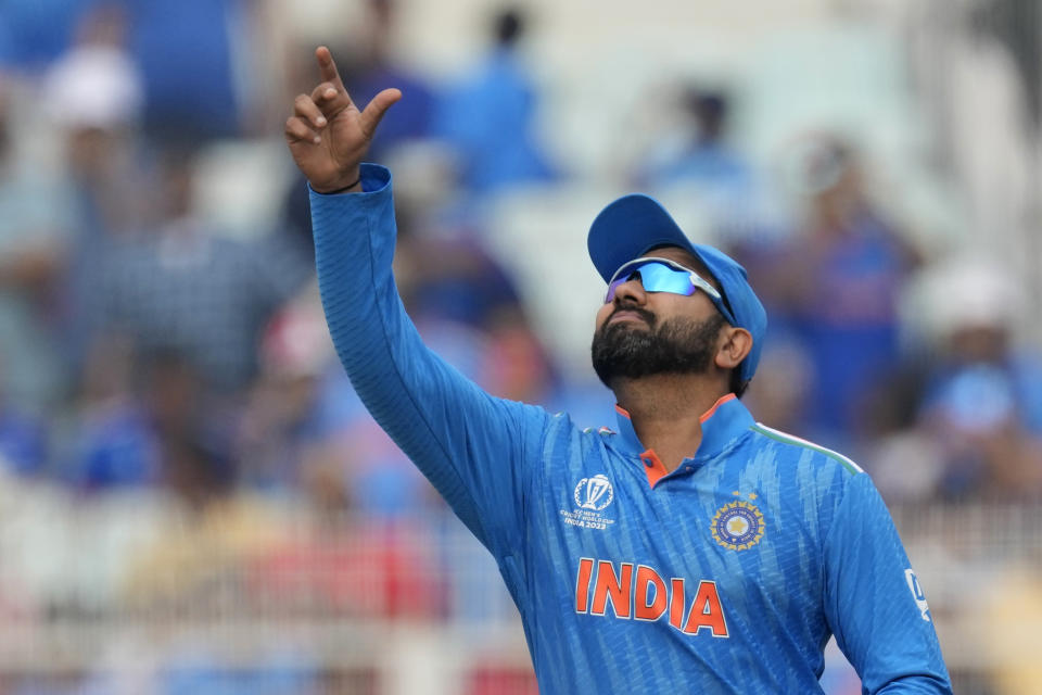 India's captain Rohit Sharma tosses a coin for toss during the ICC Men's Cricket World Cup match between India and South Africa in Kolkata, India, Sunday, Nov. 5, 2023. (AP Photo/Bikas Das)