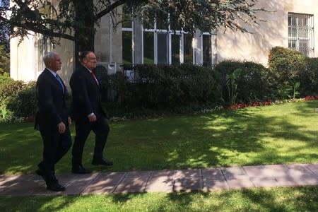 U.S. Vice President Mike Pence and Secretary of State Mike Pompeo walk out of the U.S. ambassador's residence before talks with Turkish President Tayyip Erdogan on reaching a ceasefire in Syria, in Ankara