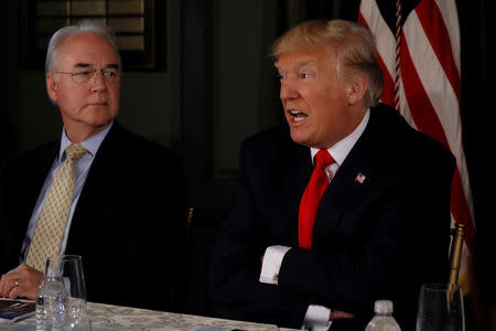 FILE PHOTO: U.S. President Donald Trump (R), flanked by Secretary of Health and Human Services (HHS) Tom Price, delivers remarks during an opioid-related briefing at Trump's golf estate in Bedminster, New Jersey, U.S., August 8, 2017. REUTERS/Jonathan Ernst/Files