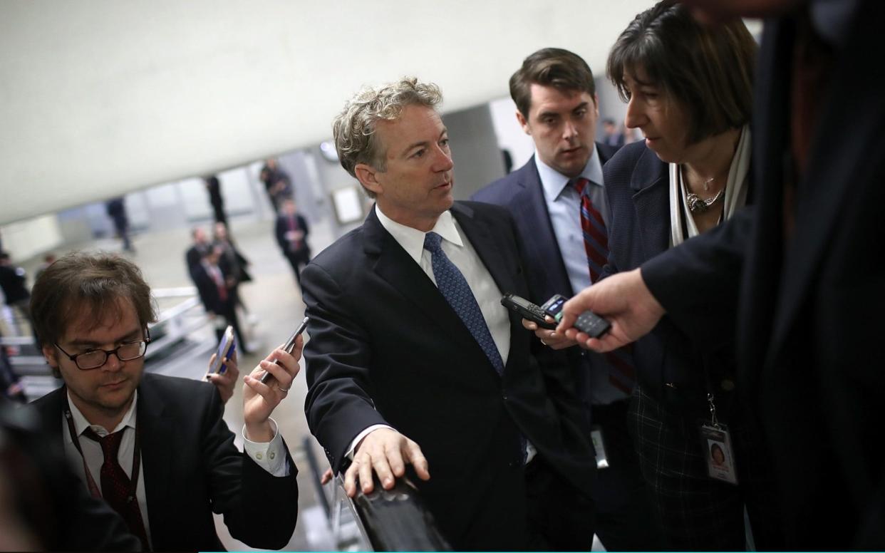 Rand Paul speaks to reporters on his way to the floor of the US Senate - Getty Images North America