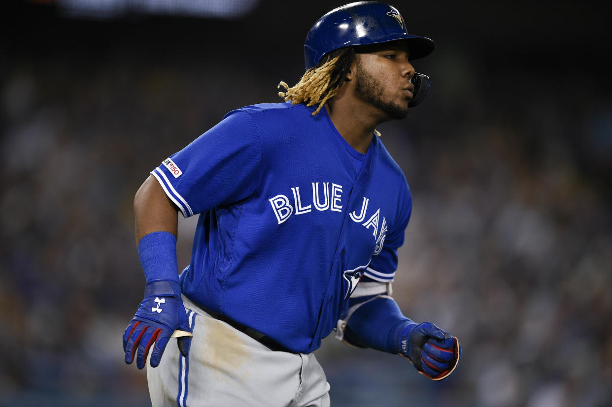 Aug 22, 2019; Los Angeles, CA, USA; Toronto Blue Jays third baseman Vladimir Guerrero Jr. (27) rounds the bases after hitting a solo home run during the sixth inning against the Los Angeles Dodgers at Dodger Stadium. Mandatory Credit: Kelvin Kuo-USA TODAY Sports