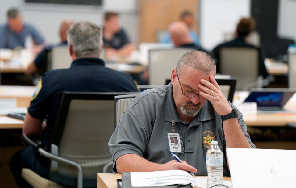 An official works during a Federal Emergency Management Agency Integrated Emergency Management Course at the Volusia County  Emergency Operations Center on April 17, 2024.