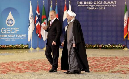 Iran's President Hassan Rouhani (R) walks with Russia's President Vladimir Putin before a meeting during the Gas Exporting Countries Forum (GECF) in Tehran, Iran, November 23, 2015. REUTERS/Raheb Homavandi/TIMA