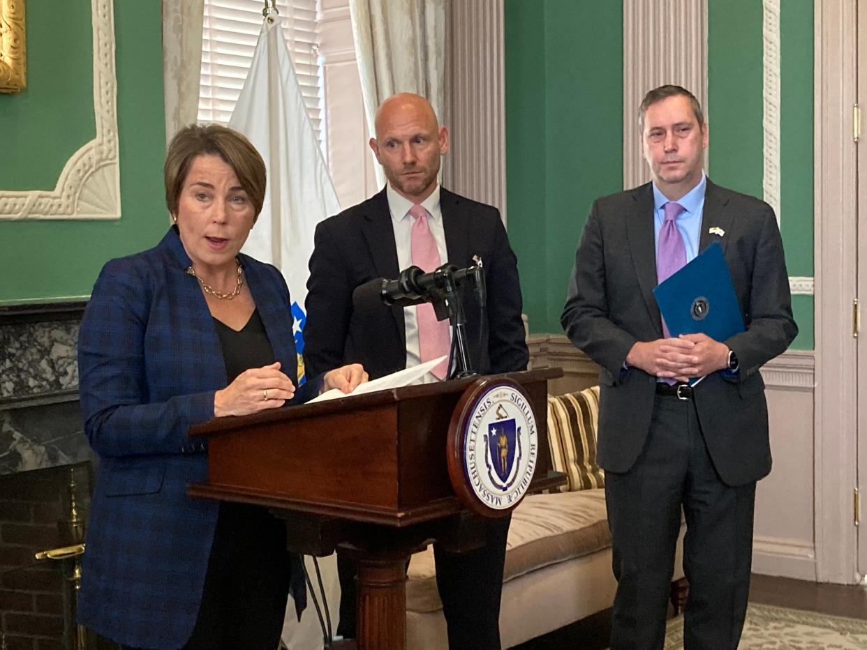 Gov. Maura Healey, with Quentin Palfrey, director of the state's Office of Federal Funds and Infrastructure, center, and Matthew Gorzkowicz the secretary of administration and finance, announce the state's intention of aggressively pursuing $17.6 billion in federal money to pay for statewide infrastructure projects, maintenance of existing assets and research and development projects.