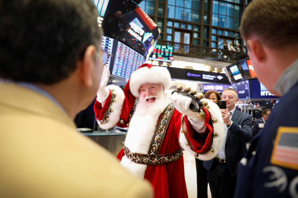 The Macy's Santa Claus waves to traders on the floor at the New York Stock Exchange (NYSE) in New York, U.S., November 27, 2019. REUTERS/Brendan McDermid