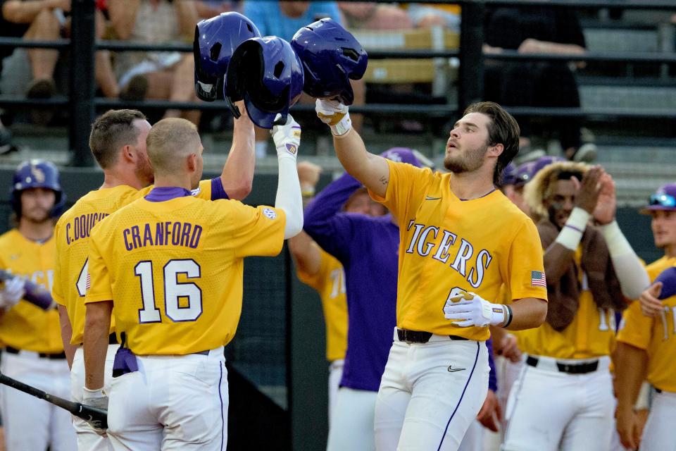 LSU utility Brayden Jobert (6) celebrates his home run with LSU infielder Collier Cranford (16) against Kennesaw St. during an NCAA regional baseball game on Friday, June 3, 2022, in Hattiesburg, Miss. (AP Photo/Matthew Hinton)