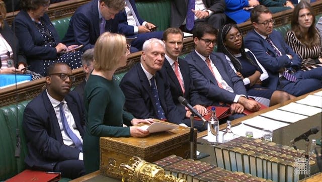 Liz Truss stands as she addressed MPs sitting in the House of Commons