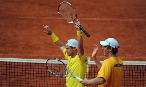 Chris Guccione (R) and Lleyton Hewitt of Australia celebrate after winning their Davis Cup World Group play-off doubles tennis match against the German team in Hamburg, northern Germany. They won 6-3, 6-2, 2-6, 7-6 (7/4 over German pair Benjamin Becker and Philipp Petzschner to give Australia a 2-1 lead over Germany