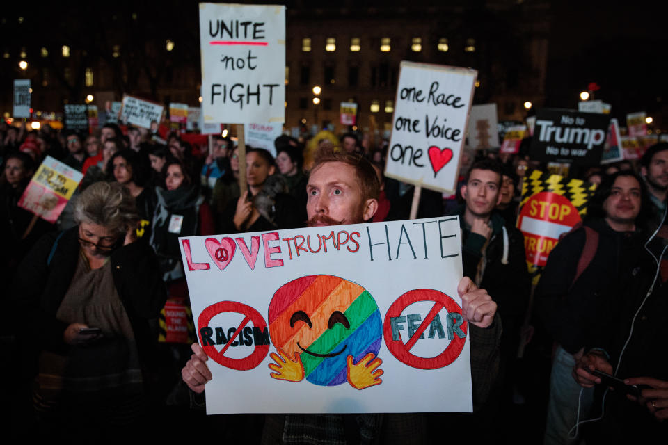 A protester holds up a placard during a rally in Parliament Square against Donald Trump’s state visit to the UK on February 20 (Getty Images)