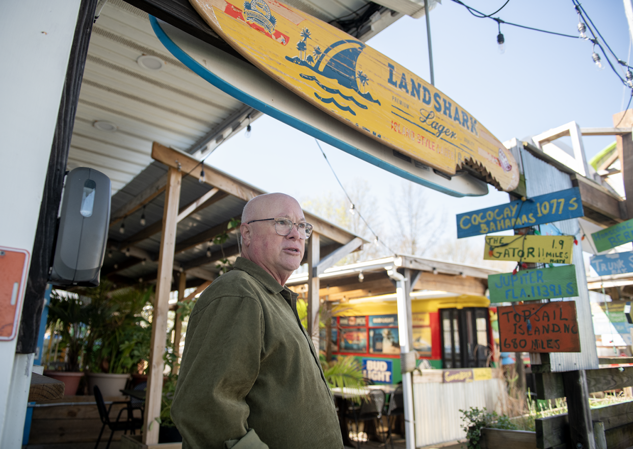 Mike's Place owner, Mike Kostensky, stands in the outdoor patio section at the Kent restaurant.