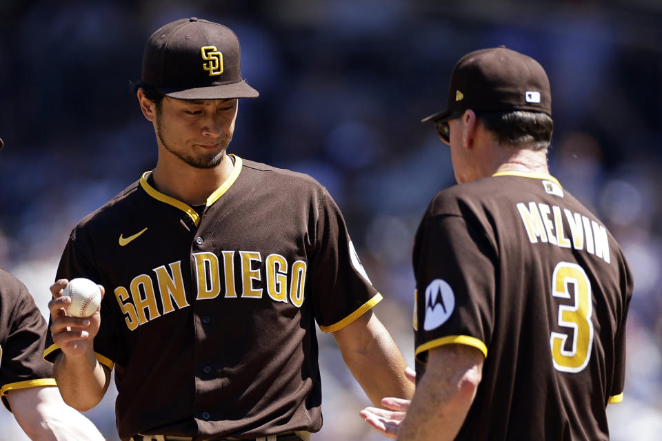 San Diego Padres pitcher Yu Darvish hands the ball to manager Bob Melvin as he is taken out of the game against the New York Yankees during the third inning of a baseball game, Sunday, May 28, 2023, in New York. (AP Photo/Adam Hunger)