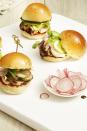 <p>These fun mini sandwiches are piled high with smoky marinated chicken that has a kick and cool crunchy veggies. You can grill the chicken ahead of time and serve them cool or at room temp.</p><p><em><a href="https://www.goodhousekeeping.com/food-recipes/easy/a22576918/grilled-chicken-sliders-recipe/" rel="nofollow noopener" target="_blank" data-ylk="slk:Get the recipe for Grilled Chicken Sliders »;elm:context_link;itc:0;sec:content-canvas" class="link ">Get the recipe for Grilled Chicken Sliders »</a></em></p>