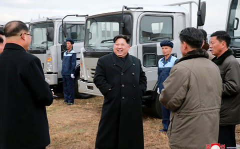 Kim Jong-un, seen having fun during an inspection of the Sungri Motor Complex in South Pyongan Province - Credit: AFP