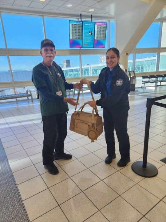 Animal Services volunteer Larry Rudolph and Butters set for takeoff from Ontario Airport to reunite the cat with his original owners in Seattle on Oct. 7, 2023. (Riverside County Department of Animal Services)