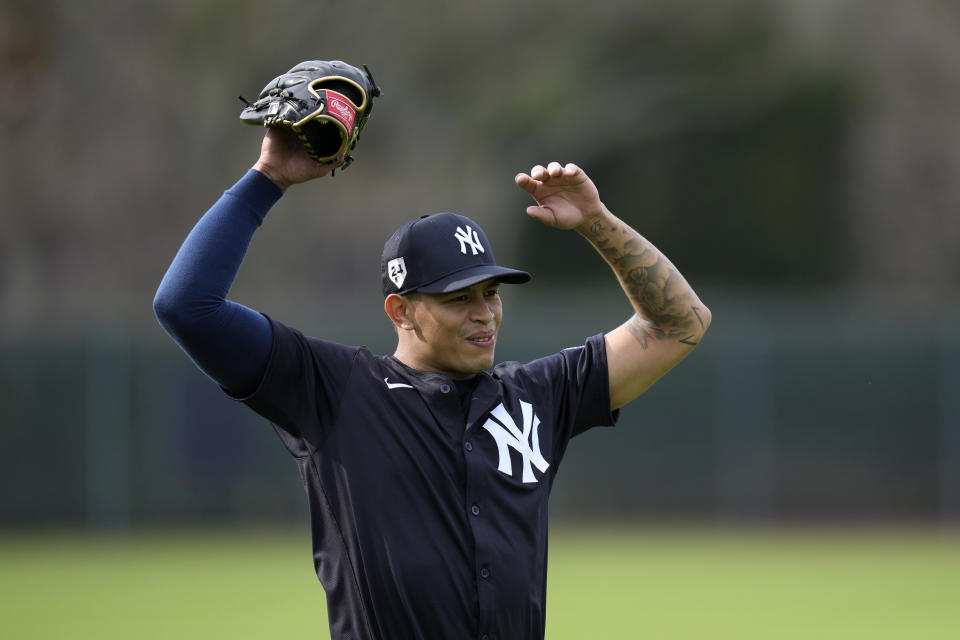 New York Yankees relief pitcher Jonathan Loaisiga stretches during a baseball spring training workout Thursday, Feb. 15, 2024, in Tampa, Fla. (AP Photo/Charlie Neibergall)