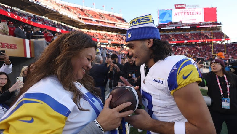 Los Angeles Rams wide receiver Puka Nacua, right, talks with his mother, Penina Nacua, after the Rams defeated the San Francisco 49ers in a game in Santa Clara, Calif., Sunday, Jan. 7, 2024.