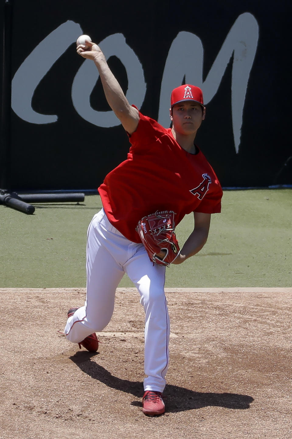 Los Angeles Angels' Shohei Ohtani throws in the bullpen before a baseball game against the Cincinnati Reds in Anaheim, Calif., Wednesday, June 26, 2019. Ohtani threw off a mound for the first time since Tommy John surgery Oct 1, 2018. (AP Photo/Chris Carlson)