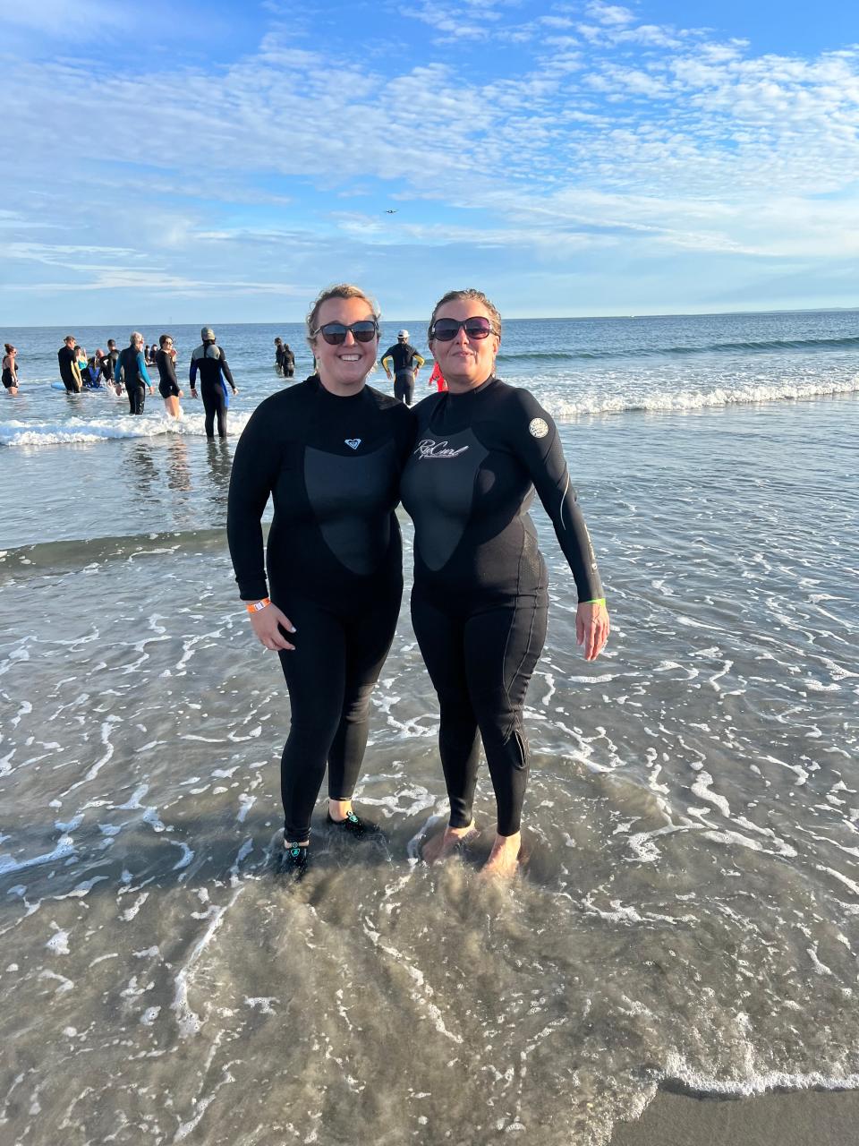 Kennebunk Savings’ employees Jess Owens and Nancy Caron volunteer at a Special Surfers event.