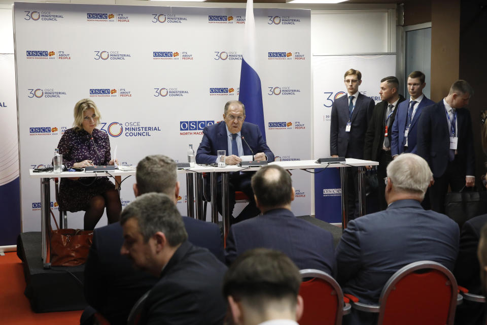 Russia's Foreign Minister Sergey Lavrov, center, speaks for the media in presence of the spokesperson Maria Zakharova, left, at a news conference, during the OSCE (Organization for Security and Co-operation in Europe) Ministerial Council meeting, in Skopje, North Macedonia, on Friday, Dec. 1, 2023. (AP Photo/Boris Grdanoski)