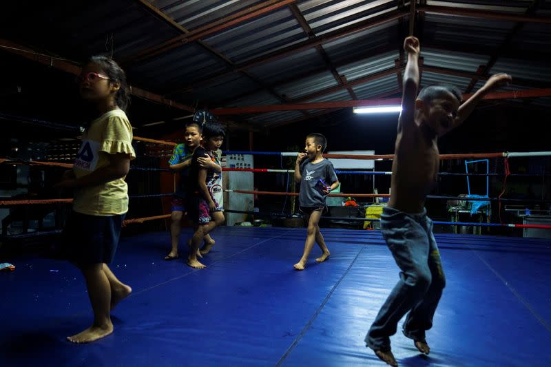 The Wider Image: Punching out of poverty: Despite risks, nine-year-old Thai fighter eager to return to ring