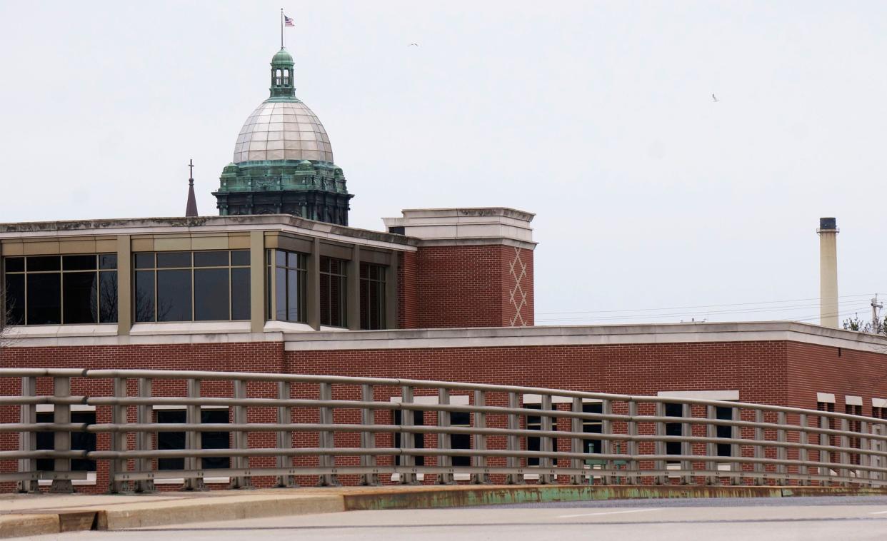 The Manitowoc County Courthouse dome rises above the cityscape that includes the Manitowoc City Hall, as seen, Friday, April 22, 2022, in Manitowoc, Wis.