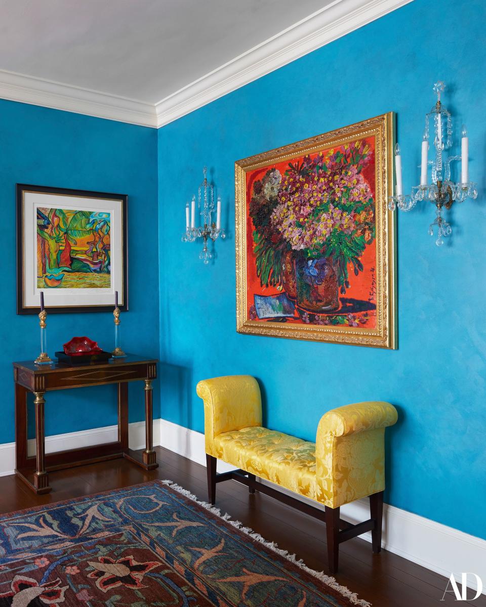 A painting by Pierce Brosnan—yes, that Pierce Brosnan—hangs above a Chihuly sculpture in the corner of the Clinton's dining room. Says Ms. Clinton, “We actually have two pieces of his work. They have a kind of French Gauguin-ish feel to them, and I just love having that there.” The pair of sconces are a 1960 custom copy of an 18th-century English design.