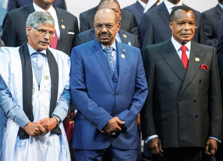 Sudanese President Omar al-Bashir (centre) attended the 2015 African Union Summit in South Africa, despite facing an arrest warrant from the International Criminal Court