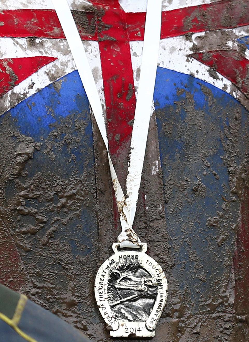 Competitor wears his medal after finishing the Tough Guy event in Perton