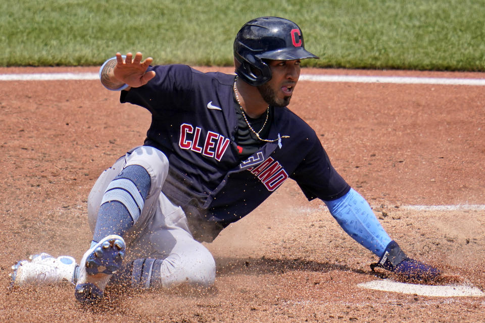 Cleveland Indians' Eddie Rosario scores from second on a single by Josh Naylor off Pittsburgh Pirates relief pitcher Chasen Shreve during the seventh inning of a baseball game in Pittsburgh, Sunday, June 20, 2021. (AP Photo/Gene J. Puskar)