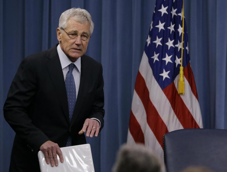 Defense Secretary Chuck Hagel arrives to brief reporters at the Pentagon, Monday, Feb. 24, 2014, where he recommended shrinking the Army to its smallest size since the buildup to U.S. involvement in World War II in an effort to balance postwar defense needs with budget realities. (AP Photo/Carolyn Kaster)