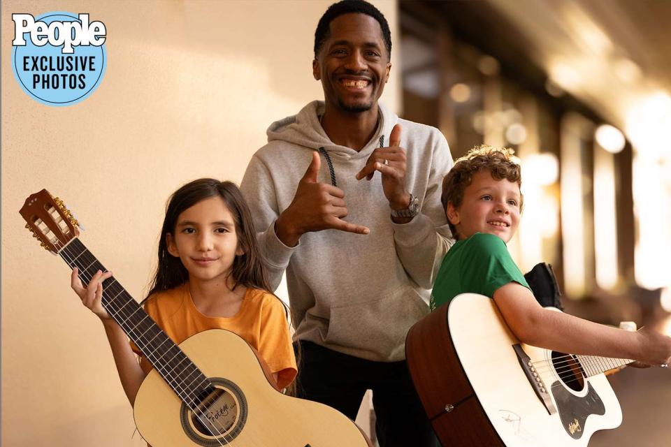 <p>J. Anthony Martinez Photography</p> Ron Artis II with instrument recipients 