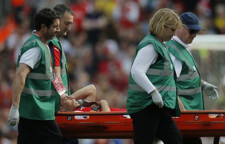 Britain Football Soccer - Arsenal v Everton - Premier League - Emirates Stadium - 21/5/17 Arsenal's Gabriel Paulista is stretchered off after sustaining an injury Action Images via Reuters / Andrew Couldridge Livepic