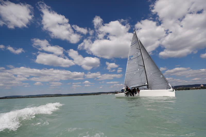 Members of a sailing race team practice on Lake Balaton, following the outbreak of the coronavirus disease (COVID-19), near Balatonfured