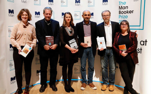 From left, Author Fiona Mozley with her book 'Elmet', Author Paul Auster with his book '4321', Author Emily Fridlund with her book 'History of Wolves', Author Mohsin Hamid with his book 'Exit West', Author George Saunders with his book 'Lincoln in the Bardo' and Author Ali Smith with her book 'Autumn'  - Credit: AP Photo/Kirsty Wigglesworth