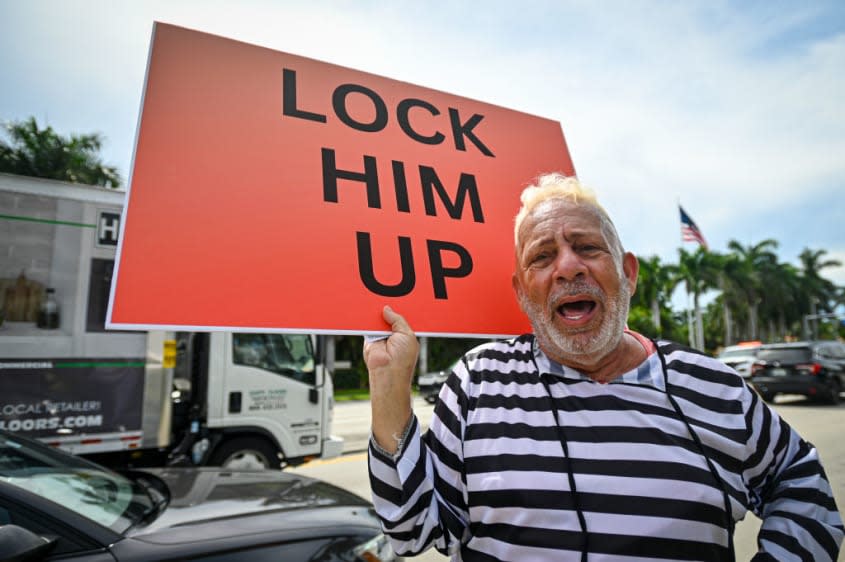 Protester calling for Donald Trump conviction 