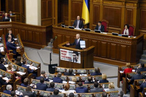 Joe Biden speaks in Ukraine's Supreme Rada in December 2015. It was on this trip that he pressed President Petro Poroshenkoto fire his much-criticised general prosecutor. Four years later, this would serve as the basis to a conspiracy theory, and eventually a US impeachment inquiry. (Reuters)