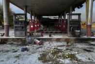 This photo released by the Iranian Students' News Agency, ISNA, shows a gas station that was burned during protests that followed authorities' decision to raise gasoline prices, in Tehran, Iran, Sunday, Nov. 17, 2019. Ayatollah Ali Khamenei, Iran's supreme leader on Sunday backed the government's decision to raise gasoline prices and called angry protesters who have been setting fire to public property over the hike "thugs," signaling a potential crackdown on the demonstrations. (Abdolvahed Mirzazadeh/ISNA via AP)