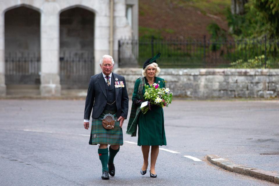 Britain's Prince Charles, Prince of Wales (L) and Britain's Camilla, Duchess of Cornwall (R) arrive to take part in a 2 minute silence to mark the 75th anniversary of VE Day (Victory in Europe Day), the end of the Second World War in Europe at the Balmoral War Memorial in central Scotland on May 8, 2020. (Photo by Amy Muir / POOL / AFP) (Photo by AMY MUIR/POOL/AFP via Getty Images)