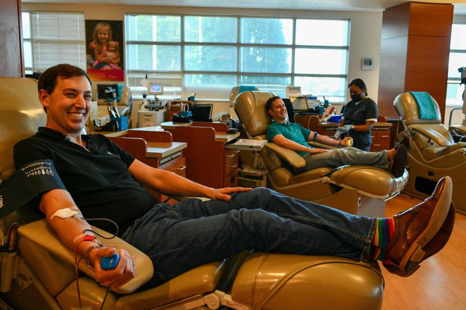 Dr. Jesse Ehrenfeld, president of the American Medical Association, donated blood for the first time, alongside his husband, Judd Taback.