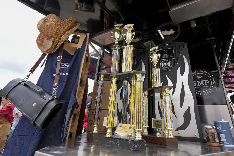 Awards and trophies are displayed outside the Sociedad Mexicano de Parrillieros team's tent at the World Championship Barbecue Cooking Contest, Friday, May 17, 2024, in Memphis, Tenn. (AP Photo/George Walker IV)