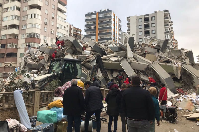 Rescue teams search for victims in February's 7.8-magnitude earthquake in Kahramanmaras, Turkey. A new report by a global insurer cites the quake as one of the most devastating natural disasters of the year, with 58,000 people killed and $50 billion in total losses. File Photo courtesy of AKUT Association